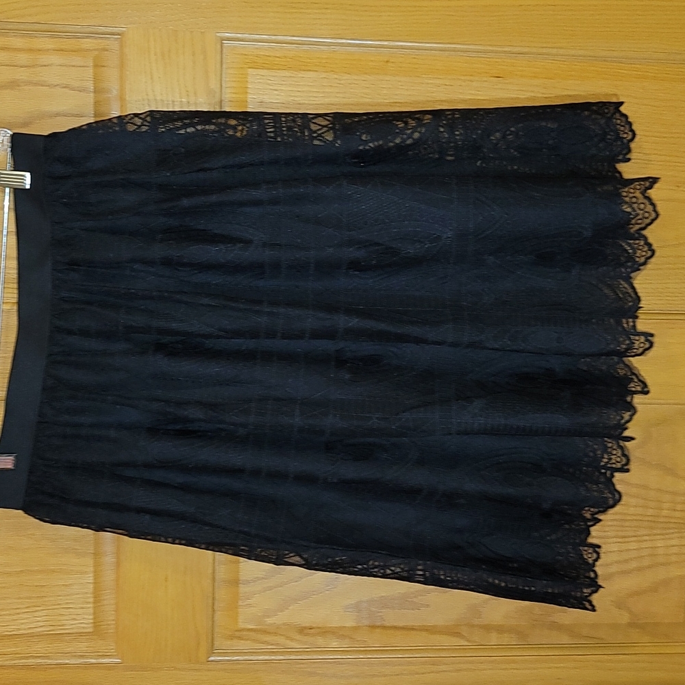 Miss Pinky black, lacy skirt, size L.